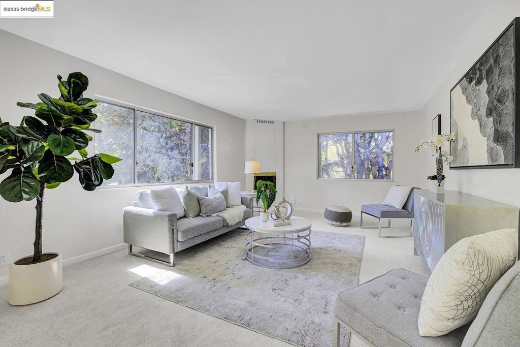 This rare top-floor corner unit is a sanctuary of light and privacy. South-facing windows flood the renovated interior with abundant, cheerful natural light, showcasing the fresh, neutral paint and pristine new carpet throughout. The modern kitchen is appointed with sleek, updated fixtures and ample storage, flowing seamlessly into the bright living area. The renovated bathroom offers a clean, contemporary finish. The unit’s prime position ensures a tranquil, tree-top perspective. The windows overlook a canopy of mature trees and the beautifully maintained courtyard below, a lush garden oasis that promises complete seclusion. This is a uniquely private and sun-drenched retreat.