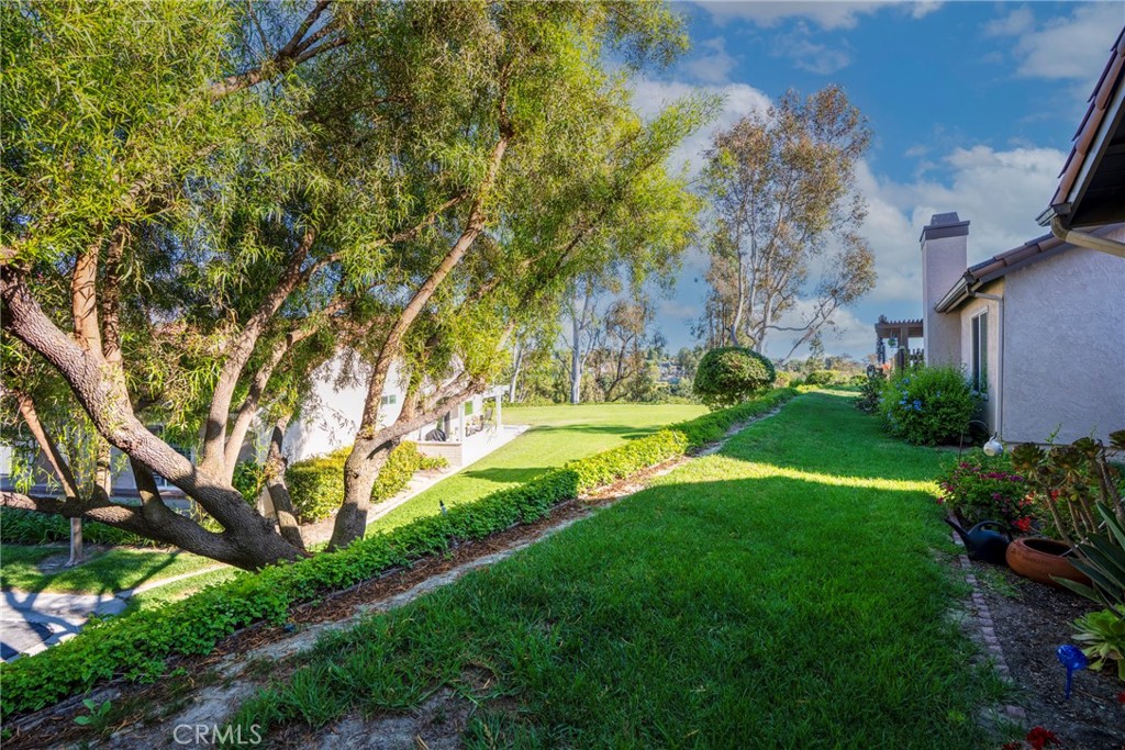 Welcome to this charming, move-in-ready home nestled at the end of a quiet cul-de-sac in a desirable 55+ gated community. With only a handful of neighboring homes, this property offers a rare combination of privacy, serenity, and scenic views.
Step into the bright and open living room, where soaring ceilings and a sun-filled solar tube create an inviting, airy atmosphere. The freshly painted interior and open floor plan flow seamlessly into the newly remodeled kitchen, complete with bar seating and a picturesque window overlooking the mountains and mature trees—a perfect backdrop for your morning coffee.
The primary suite features high ceilings and newly installed windows, bringing in natural light and highlighting the tranquil surroundings. Both bathrooms are updated, with one beautifully remodeled for a fresh, modern touch. Thoughtful upgrades throughout include a newer HVAC, furnace, and water heater for efficiency and peace of mind.
Outdoor living shines with a lovely private patio and quaint backyard, the ideal spot for morning coffee, evening wine, or quiet gardening. The side patio adds even more flexibility for outdoor enjoyment or creating your own retreat space.
Located in a well-maintained, 55+ gated community, this home offers the perfect balance of comfort, low-maintenance living, and security, all just minutes from shopping, dining, and local amenities.
If you’re seeking a peaceful, private home with modern upgrades, mountain views, and inviting outdoor spaces, this is the one you’ve been waiting for!