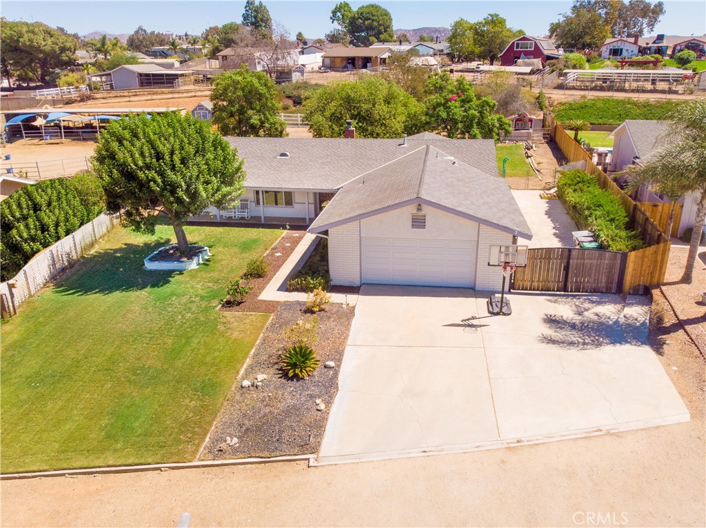 Take a Look at this Spacious 3-Bedroom Single-Story Home Located in a Desirable Norco Neighborhood on a Quiet Cul-De-Sac. Sitting on a Huge Lot that backs directly to a Horse Trail, This Property offers Plenty of Room for Animals, Outdoor Activities, and Country-Style Living. An Additional Room provides Flexibility and could be Converted into a 4th Bedroom if needed. Inside, the Home Features a Country-Style Kitchen that Opens to a Large, Bright, and Airy Living and Dining Area—Ideal for Gatherings. The Kitchen is Fully Equipped with High-End Appliances, including a Sub-Zero Stainless Steel Refrigerator, Wolf 6-burner Stove, Jenn-Air Dishwasher, Farmhouse Sink, Wood Counters, and a Large Center Island. The Living Room is Warm and Inviting, Highlighted by a Raised-Hearth Fireplace and a Large Skylight that Fills the Space with Natural Light. The Roomy Primary Suite Includes its own Private Bath with an Oversized Jetted Tub, Perfect for Relaxing after a Long Day. Additional Features include Wood-Look Plank Tile Flooring, Newer Windows, Updated Light Fixtures, Ceiling Fans, Fresh Exterior Paint, and a New Garage Door. Outdoors, Enjoy a Covered Patio Overlooking the Expansive Backyard, Complete with a Kids’ Treehouse, Planters Ready for a Vegetable Garden, and Plenty of Space for RV Parking. A Chicken Coop is also Included, Adding to the Property’s Charm and Versatility. With its generous Lot, Horse Trail Access, and Comfortable Single-Story Design, This Home is the Perfect Blend of Rural Lifestyle and Modern Convenience. A Must-See in Norco!
