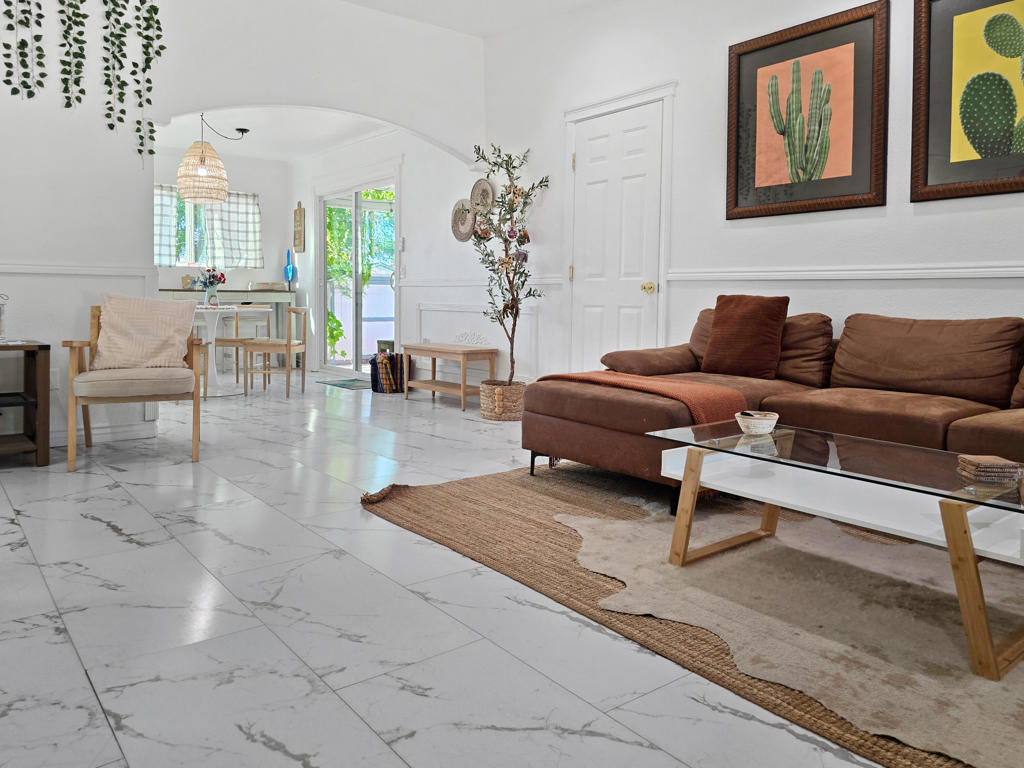 Located just a short 5-minute drive from the Joshua Tree National Park entrance and within walking distance to the village, this fully furnished home offers the perfect blend of comfort and convenience. With 4 beautifully designed bedrooms and 2 modern bathrooms spread across 1,248 sq. ft., the property boasts designer finishes throughout. The remodeled bathrooms feature stunning floor-to-ceiling tiled showers, while the updated kitchen is equipped with sleek stainless-steel appliances and stylish tile backsplash. The outdoor spaces are equally impressive, with spacious front and back yards, a serene water feature, a relaxing hot tub, a cozy firepit, and hammocks for unwinding. Enjoy breathtaking views from the backyard, making this a truly exceptional retreat for a savvy investor, a second home, or even a primary residence.