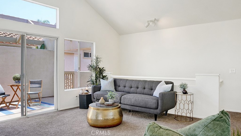 2-Bed, 2-Bath Condo in Laguna Niguel’s Sought-After Palm Court Community. Discover coastal living in this beautifully maintained upper carriage unit featuring vaulted ceilings, abundant natural light, and a cozy fireplace. The open floor plan seamlessly connects the living room, dining nook, and kitchen, creating a bright and inviting space that flows to a private outdoor patio—perfect for morning coffee or evening relaxation. Enjoy two spacious bedrooms positioned on opposite sides of the home for added privacy. The guest bathroom offers a walk-in shower, while the primary suite features a shower-tub combo and its own private patio retreat. Additional highlights include central A/C, track lighting, in unit stackable laundry and a one-car attached garage with storage. Residents of Palm Court enjoy resort-style amenities including a sparkling pool, spa, and ample guest parking. Located just off Golden Lantern, you’re minutes from Laguna Niguel’s shops, dining, hiking trails, and only a short drive or bike ride to the beach—embracing the very best of Orange County living.