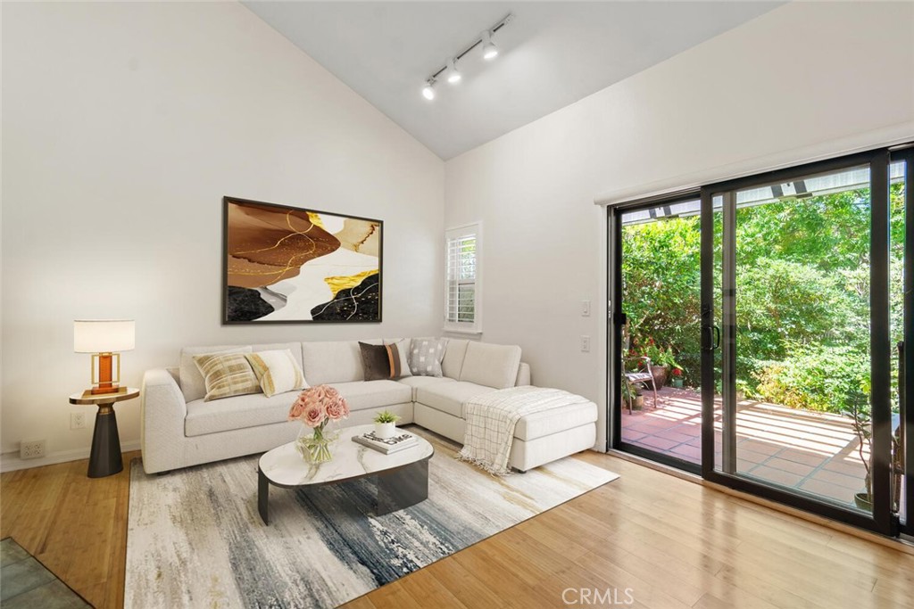 Welcome home to the prestigious, security-gated neighborhood of Manhattan Beach Village. This beautiful, bright and clean 2-bedroom/2.5 bathroom townhouse has vaulted ceilings in the primary bedroom with a balcony and a large primary bathroom that features multiple closets for conveniently getting dressed after bathing. The second bedroom overlooks a gorgeous, peaceful outdoor pond and the second bathroom is directly across the hallway from this room. The middle floor includes an open floor plan of the living area and kitchen connecting. The kitchen includes all updated stainless steel appliances including refrigerator, stove and dishwasher. Also on the main level, there is a room that can be used for an office or work out room and half bathroom with a separate area for the washer/dryer. Additional cabinets for storing linens/towels and personal belongings area also located on this level. The ground level has a sitting room with a fireplace that attaches to an outdoor patio for grilling, entertaining or simply relaxing and enjoying the California sunshine. The property also includes a large 2-car attached garage with tons of storage. There is also ample parking in the parking lot just steps away from the townhouse. The location is centrally located in Manhattan Beach close to the ocean, Manhattan Village shopping center, restaurants, the Manhattan Beach Pier, gyms, easy access to the 405, next door to Marine Park/Adventure Plex, and is included in the award-winning Manhattan Beach School District. Lastly the complex includes a large heated swimming pool, hot tub and children's playground, and backs up to a par three golf course, and the local country club.