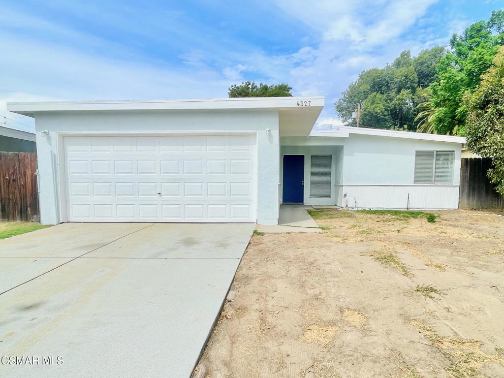 60's charm! This clean, painted, move-in ready 3-bedroom home offers a large living room, spacious eat-in kitchen, and full bath with walk-in shower and dual-sink vanity. Backyard access from kitchen, living room slider, and hall door. Features new vinyl plank flooring, brand-new roof, and laundry hookups in the 2-car garage. The spacious yard is your blank canvas and priced for a starter home. Also brand new are the bathroom sinks, faucets, toilet, furnace, oven range, and AC wall units in living area and primary bedroom.