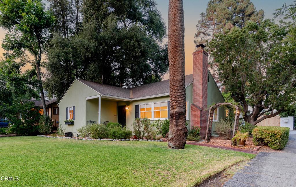 Nestled beneath the shade of a majestic California live oak on a picturesque tree-lined street, 1830 N. El Molino blends timeless charm with thoughtful modern updates. The home's inviting curb appeal begins with a manicured front lawn, brick walkway, and welcoming front porch. Inside, beautifully refinished original hardwood floors immediately set a warm and classic tone. The sunlit living room, anchored by a cozy gas fireplace, opens via double doors to a formal dining room, perfect for gatherings and entertaining. The adjacent chef's kitchen features state-of-the-art appliances, generous cabinetry, and a charming breakfast nook overlooking the backyard. Glass sliders lead to a spacious patio with mountain views, ideal for outdoor dining or relaxing evenings under the stars. The tiered backyard provides ample room for gardening, entertaining, or even future expansion or an ADU. One of the home's three bedrooms offers direct backyard access, making it ideal for a guest room, office, or fitness space, while the other two bedrooms enjoy tranquil views of the lush yards. A recently renovated bathroom showcases stylish, high-end finishes. Key recent upgrades include a new roof, new wooden fencing, lead-based paint remediation, a modern water filtration system, and an upgraded EV charging outlet. Located in a peaceful neighborhood with convenient access to Pasadena's shops, restaurants, parks, and cultural attractions, this home is a true gem you won't want to miss.
