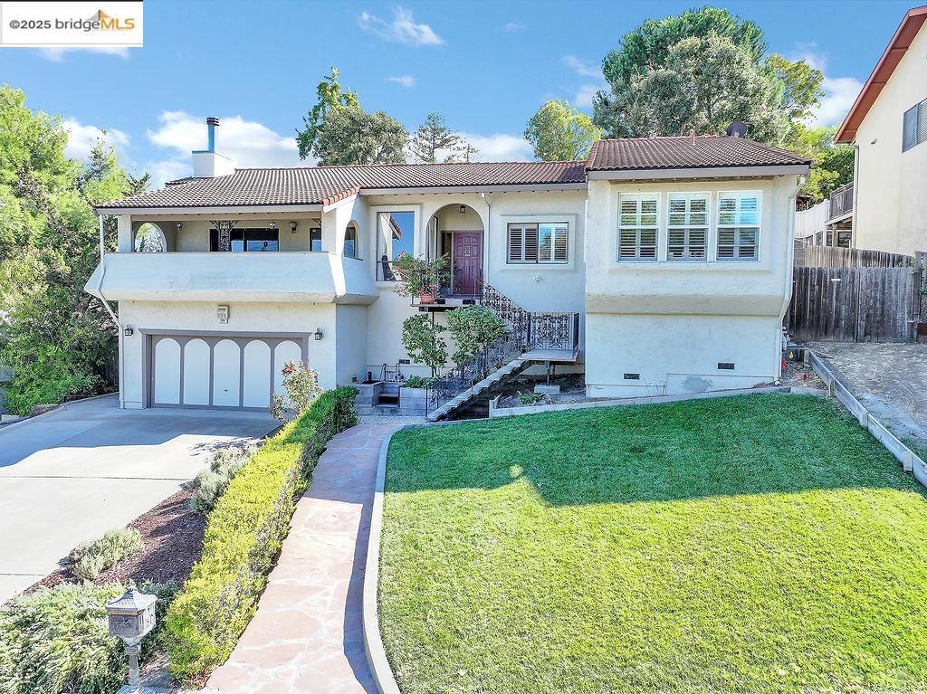 Welcome to 224 Hillside Road — A stunning home tucked into a peaceful Antioch hillside on over a quarter-acre lot, offering both privacy and beautiful views. Featuring 4 bedrooms and 2.5 baths, this residence has been carefully updated with desirable finishes throughout. The kitchen shines with granite countertops, a gas cooktop, and recessed lighting. Rich laminate flooring flows through most of the home. Entertain guests in style in the formal dining room, or cozy up in the family room centered around a gorgeous gas fireplace. Large sliding doors from both the dining and family rooms open to elevated patios, capturing sweeping views above street level, letting in natural light and bringing fresh air inside. Gorgeous sunset vistas make these spaces a daily delight. Outside, discover a very private, expansive backyard full of potential — gardens, play areas, or outdoor living are all possible. A spacious deck provides a serene spot to relax, host friends, or simply soak in the tranquility and views. Situated on a quiet street but still close to schools, shopping, and freeway access, this home offers the best of both worlds. Don’t miss the opportunity — homes like this, with this setting, don’t come along often.