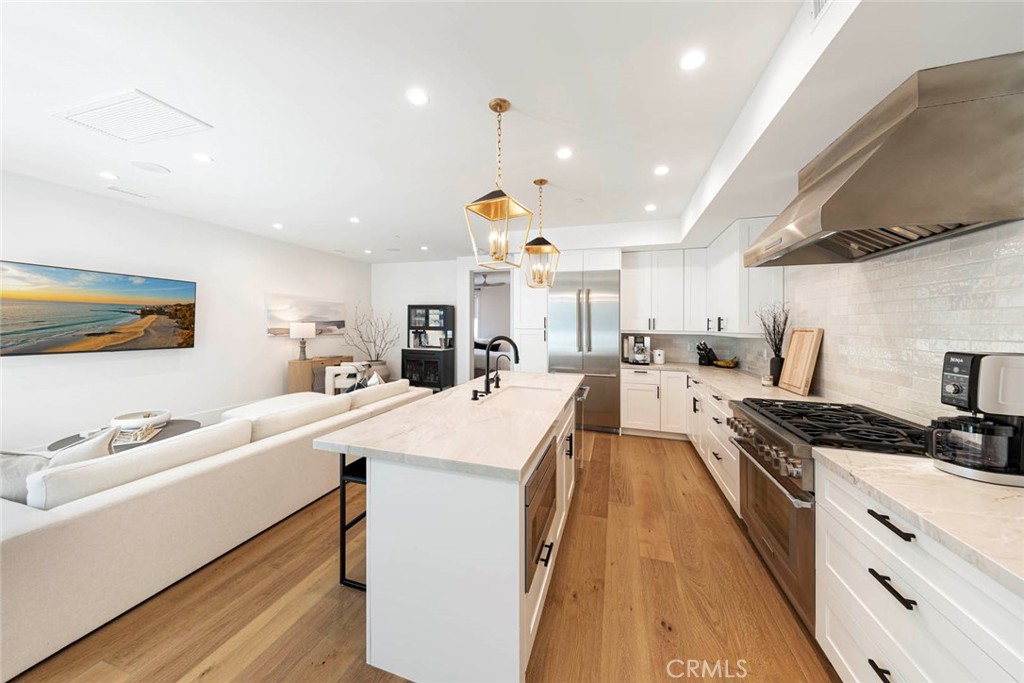 Modern Coastal Luxury in the Heart of Corona del Mar Village. Experience the perfect blend of style, comfort, and sophistication in this beautifully designed coastal modern home. With its superior finishes, thoughtful craftsmanship, and effortless flow, this residence is built to impress.
Step through the charming Dutch door and into an open-concept floor plan that defines California indoor/outdoor living. The gourmet kitchen is a true showpiece, featuring custom cabinetry, subway tile backsplash, an oversized island, and top-of-the-line Thermidor appliances. Wide-plank wood flooring and natural stone details create a warm yet refined coastal-chic atmosphere throughout. The primary suite is tucked just off the main living area, offering a serene retreat with dual sinks, a freestanding soaking tub, and an enclosed rain shower, your very own spa-like sanctuary.
Entertain or unwind on the private rooftop deck, where ocean breezes and endless sunsets set the perfect backdrop for lounging or gatherings.
All of this is set within the sought-after Flower Streets, just a short stroll to pristine beaches, world-class dining, boutique shopping, and the vibrant lifestyle that makes Corona del Mar one of Southern California’s most desirable coastal communities.