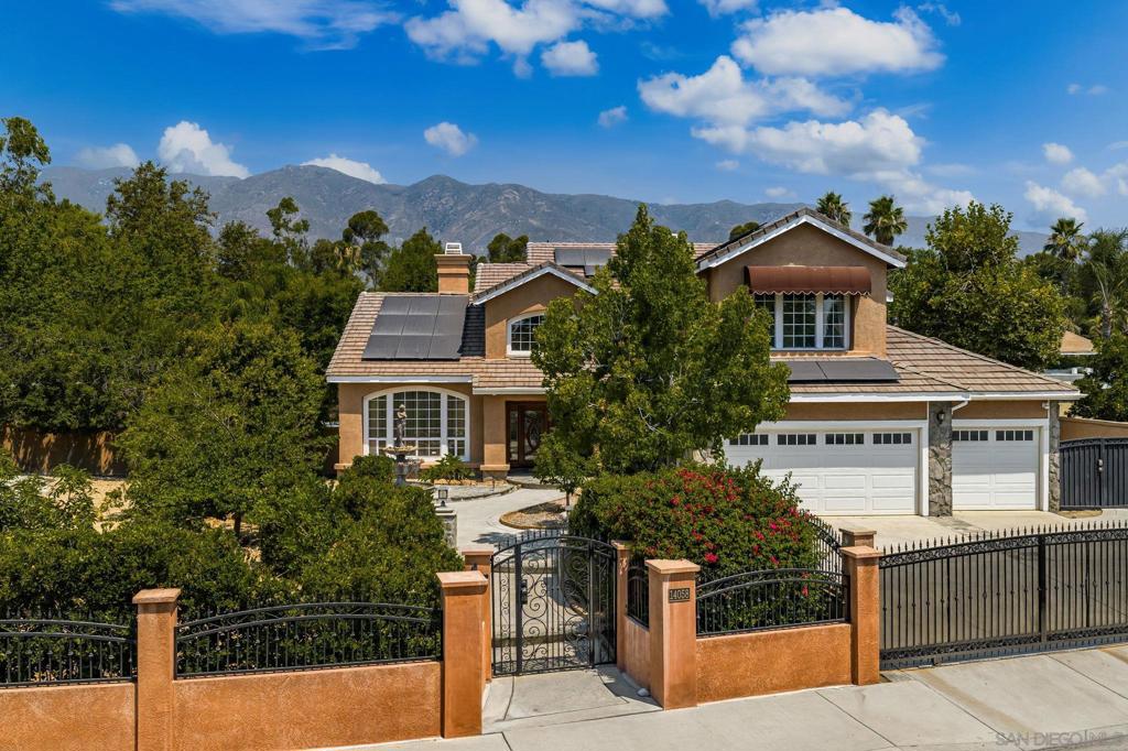 Welcome to your dream oasis in the charming Etiwanda neighborhood. This stunning home showcases over 3,074 square feet of elegant living space, on a 16,200 sqft lot, thoughtfully designed to offer both luxury and comfort. As you enter, you are greeted by a formal living room and dining area, featuring an exquisite double-sided gas fireplace, perfect for cozy evenings and elegant gatherings. The gourmet kitchen is a chef's delight, complete with a central island and abundant counter space, seamlessly flowing into a warm family room with its own fireplace. On the main floor, you'll find a convenient bedroom and full bath, ideal for guests or a home office. Retreat to the luxurious master suite, where relaxation meets elegance. Enjoy the warmth of a private fireplace or step out onto your personal balcony to savor stunning views. The master bathroom is equipped with dual sinks, two expansive walk-in closets, and a separate tub and shower. Two more bedrooms upstairs with a Jack n Jill bathroom set up. Step outside to the unparalleled backyard oasis! Dive into the refreshing pool with a slide, unwind in the spa, or host a memorable dinner at the built-in outdoor kitchen. The kitchen features a BBQ, stovetop, wood-burning pizza oven, and EVO grill top, making alfresco dining a breeze. Additional amenities include a versatile shed and an extra space that could serve as a man cave or office. Set on a large lot adorned with amazing fruit trees, this home offers breathtaking views of the mountain caps. Home boasts a 3-car garage, solar panels, and car chargers... A MUST SEE HOME