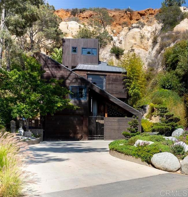 A Sanctuary of Architectural Poetry: Where Nature Embraces Design Nestled among ancient Torrey pines and dramatic sandstone cliffs, this extraordinary home is more than a residence—it's a living canvas where architecture and nature dance in harmonious dialogue. Masterfully designed by the acclaimed architect Rob Wellington Quigley, this property is a profound meditation on the delicate relationship between human habitation and natural landscape. Imagine waking to a symphony of birdsong, with gentle breezes rustling through bamboo and the rhythmic whispers of a Japanese garden flowing beneath your windows. Each carefully crafted space feels like an intimate conversation between indoor comfort and the breathtaking oceanic panorama beyond. The home's thoughtful layout unfolds across three levels, offering remarkable flexibility. Two ground-floor bedrooms provide serene private retreats, while the main living area on the second floor becomes a stunning gathering space that seamlessly blends indoor elegance with expansive ocean views. The upper level houses the master suite—a tranquil sanctuary offering both privacy and connection to the surrounding natural beauty. Exquisite details elevate every corner: solid Brazilian hardwood floors that tell stories of craftsmanship, bronze railings that catch sunlight like sculptural elements, and custom windows that transform each view into a living artwork. Whether you're seeking a family home, a creative retreat, or a multigenerational haven, this property offers a rare opportunity to live in profound harmony with your environment. More than just a house, this is an invitation to experience architecture as a form of poetry—where every room, every window, every moment celebrates the magnificent dialogue between human creativity and nature's timeless beauty. Can rent the home furnishe or unfurnished. The lease will be for the main home only and not the seperate tower accessory dwelling. ***Included in the monthly rent: Gardener, Trash, Sewage and Landlord agrees to pay for water up to $250 and electricity up to $500 per month. Tenant shall be responsible for any and all charges of water and electric exceeding those monthly allowances.***