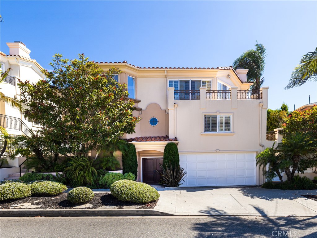 Welcome home to this gorgeous and well-appointed four-bedroom, 3.5-bathroom home situated a few blocks from the ocean and Redondo Beach pier. The property is tri-level with each floor designed for optimal living. The entry level offers a bedroom suite, laundry room, and large garage with plenty of extra space for storage. The second level provides two nice sized bedrooms with jack and jill bathroom as well as a large primary suite with fireplace, walk-in closet, spacious bathroom, and ocean view. The third level provides an open floor plan with a living room, kitchen, dining room, and a half bath. The living room offers spectacular ocean views and plenty of space for an oversized sofa where you can breathe in the ocean air or snuggle with a blanket on a cool evening while you enjoy the warmth of your fireplace. The kitchen is well-equipped with a large island, granite counters, double oven, oversized refrigerator, and pantry. Then continue to the rooftop deck and enjoy a beverage while you take in the breathtaking ocean views. This home provides an adorable side yard that’s gives you more outdoor space to relax, entertain, or for kids and pets to play. With top notch schools, fine dining, shopping, and the ocean/beach at your fingertips, you are certain to enjoy the best life has to offer.