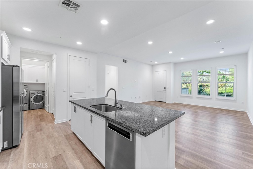 Welcome to this rare and freshly painted, ground-floor, single-level 2-bedroom, 2-bathroom home featuring soaring ceilings and an attached tandem 2-car garage with built-in storage. Located in the highly sought-after Portola Springs community, this home offers the perfect blend of comfort, style, and convenience.
The open-concept kitchen is a chef’s dream, featuring crisp white cabinetry, granite countertops, and a large center island with bar seating. The laundry room is conveniently located inside the home near the kitchen.
The spacious primary suite includes a walk-in closet and a luxurious ensuite bathroom with a walk-in shower. The second bathroom includes a full-size tub—perfect for relaxing or for families with young children.
Enjoy outdoor living on the inviting front patio, ideal for a BBQ and seating area.
This home is within walking distance of two beautiful community parks—Greenfield Park and Village Square Park—both offering resort-style amenities including pools, spas, two playgrounds, a kiddie pool, BBQ area, clubhouse, tennis court, and basketball court.
Zoned for award-winning Irvine Unified schools, including the new Portola Springs Elementary (within walking distance) and state-of-the-art Portola High School. Conveniently located near Woodbury Town Center, shopping, dining, and major freeways.
Tenants are responsible for water, trash, electricity, gas, and Wi-Fi. Landlord covers HOA dues.