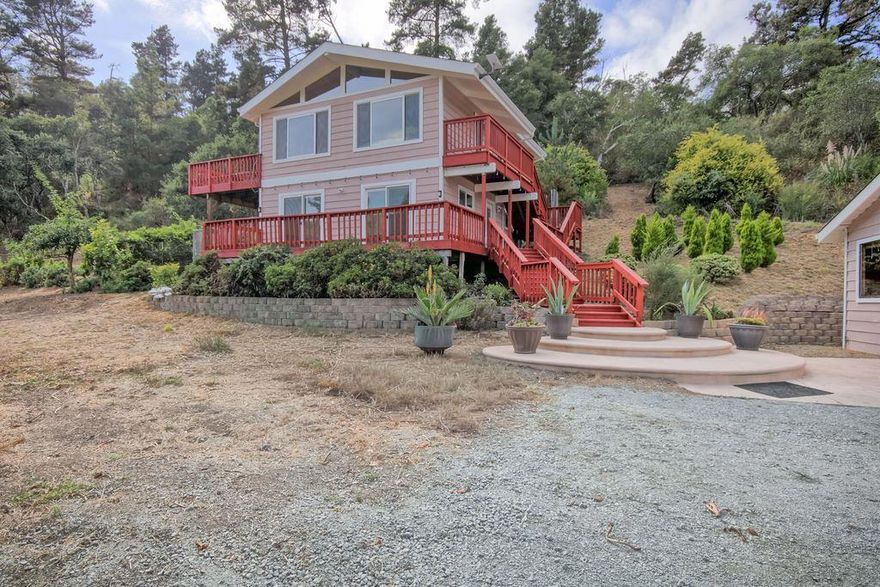 Discover your countryside retreat at 687 Calabasas Rd, a peaceful 10-acre sanctuary in the Aptos Hills. This upgraded 3-bedroom, 2-bathroom home seamlessly blends rustic charm with modern comfort. A reverse floor plan maximizes natural light and panoramic views, while the remodeled kitchen features maple cabinets, quartzite countertops, and a new range. Updated bathrooms and laundry, radiant tile floors, solid wood floors, insulated walls, and fresh interior paint create a warm inviting feel. Upgrades since 2013 include a 550-ft well with pump and tank, a 50-year roof with skylights, energy-efficient windows/doors, and new heaters. A wood stove adds cozy ambiance. The detached 2-car garage w/220V, insulated art studio w/skylights and storage sheds add flexibility. Outdoors, enjoy deer-fenced gardens & orchard (featuring citrus, plums, apples, pears, figs, olives & more), redwood deck, a stamped-concrete entry, a retaining wall with a French drain & creek stabilization, showcasing years of care. Just minutes from town, this rare property offers privacy, acreage & turnkey upgrades, a true country gem.