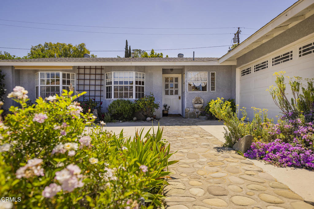 Located in the Rolling Hills Estates neighborhood, this four-bedroom home is just a walk or bike ride away from dining, shopping, the post office, grocery stores, and more. It is also just a short drive to the shops, cafes, spas, and galleries in Ojai's downtown village and the camping, fishing, and water park at Lake Casitas. This approximately 1,958-square-foot home has an open floor plan with flexible spaces, large closets, ceiling fans, a walk-in pantry, a gas fireplace with a brick hearth, and an extra-large family room with a garden window. There are also unique touches throughout that make this home stand out, such as the molding around the interior doors, wainscoting, clawfoot bathtub, two bay windows with window seats, a built-in desk and bookshelves, and a vintage O'Keefe & Merritt gas range. Outside, there is a covered patio, an additional patio, garden area, RV parking, two-car garage, drought-resistant landscaping, and a river rock walkway and borders in the front yard.