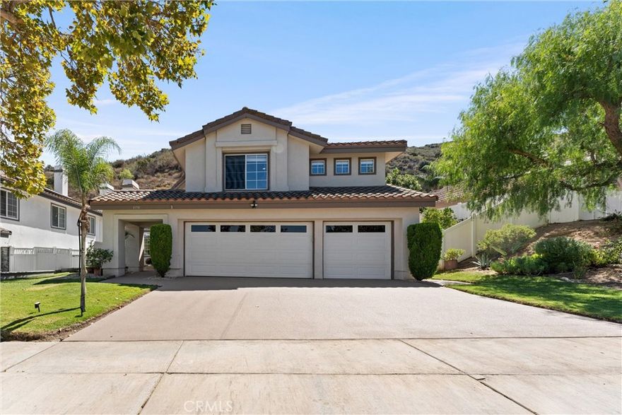 DOWNSTAIRS BEDROOM + BATHROOM | REMODELED KITCHEN | QUICK COMMUTE TO OC | Welcome to this stunning 5-bedroom, 3-bathroom home nestled in the highly desirable Sierra Del Oro neighborhood of Corona. From the moment you step inside, you are greeted with soaring ceilings, abundant natural light, and an open layout that feels both spacious and inviting. The Living Room offers a cozy fireplace and flows seamlessly into the Dining Room, while the Family Room features its own fireplace—an ideal spot for gatherings and entertaining. The Chef’s Kitchen is beautifully upgraded with premium natural Silestone countertops, a custom backsplash, deep sink, breakfast bar seating, eating nook, pantry, pot and pan drawers, upgraded slow-close drawers and doors, oven and new 5-burner gas stovetop—designed to delight any culinary enthusiast. A convenient downstairs Bedroom is located next to a full Bathroom with a walk-in shower, perfect for overnight guests or multigenerational living. Upstairs, the Primary Ensuite Bedroom is a true retreat, showcasing cathedral ceilings, generous windows, and a large walk-in closet. The spa-inspired Ensuite Bath offers dual sinks, a walk-in shower, deep soaking tub for luxurious relaxation. Three additional upstairs Bedrooms are well sized, offering flexibility for family, guests, or a home office. The remodeled upstairs Bathroom includes dual sinks, a frameless shower, and vanity space. The Laundry Room offers excellent functionality with ample cabinetry. Step outside to your private backyard oasis, featuring a raised seating area, fruit trees, and low-maintenance vinyl and wrought iron fencing—perfect for relaxing or entertaining outdoors. UPGRADES: New AC, blower, heater, ducting, insulation vents; new garage door and new epoxy driveway, sidewalk and front porch. ENERGY EFFICIENCY: Solar Panels, LED lighting, and low-flow bathroom elements. GREAT COMMUTING: Enjoy the short commute off Green River exit - 1st exit from Yorba Linda and Anaheim Hills with easy access to 91 Expressway, 241 Toll Road, 71/55/57/15. NEARBY: Shopping, dining, parks, golf course, and hiking trails. For the discerning buyer seeking privacy combined with the perfect location this home is a rare find!
