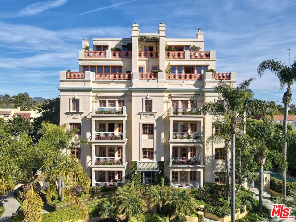 Originally built in 1928 and meticulously reconstructed in 1996, the historic El Tovar By The Sea seamlessly blends three distinct architectural periods: Classical Revival, Streamline Moderne, and Modified Classical Mediterranean. Nestled on the upper central end of Ocean Avenue, this full-service luxury building remains one of the most coveted addresses, and its 22 residences are among the most exclusive. Sitting above them all is the coveted jewel of the property - Penthouse South. Upon entering the exquisitely appointed foyer, the elevator will take you directly to a silk wallpaper-lined vestibule where your front door awaits. Step inside to be greeted by breathtaking ocean vistas and a sun-drenched living room bathed in southern light. French doors open onto a sweeping wrap-around balcony to take in the ocean air and watch the palm trees sway in serene privacy.The high ceilings and designer details complement this striking space that is as suitable for entertaining as it is for a quiet night at home by the wood burning fire. The formal dining room boasts Zuber hand-painted wallpaper, gold leaf ceiling, and views of the coast through the kumquat trees on the patio. The spacious kitchen with a generous island features top-of-the-line appliances, a separate butlers pantry providing ample storage, and a large adjacent laundry room. An elegant powder room with an antique vanity completes the first floor. Venture upstairs to discover the secluded sleeping quarters. The en-suite guest room features stunning views of the snow-capped mountains and two large closets. Down the hall, the spectacular primary suite beckons - here, you will feel transported as you look out from Palos Verdes to Point Dume and hear the gentle roar of waves as the sound cascades from the ocean. Step out onto the large balcony with separate sitting areas for sunny afternoon reading. Drift back inside and envision yourself immersed in another world as you enjoy the bedroom's fireplace before turning in for the night. The spa-like primary bath features Venetian plaster walls, soaking tub, and steam shower. A separate office space with views and balcony provides the ideal setting for your virtual work or a private space for study. Solid oak hardwood floors throughout underscore the grandeur of every detail. The home includes private 3 plus car garage with custom built-in storage cabinets. The building's state-of-the-art fitness center, pool, spa, and lush landscaping rival those of 5 star hotels. Situated along the bluffs of Palisades Park and just a short stroll from shops and restaurants - this is California living at it's finest and steeped in the history of iconic Ocean Avenue. When you are here, you are truly home