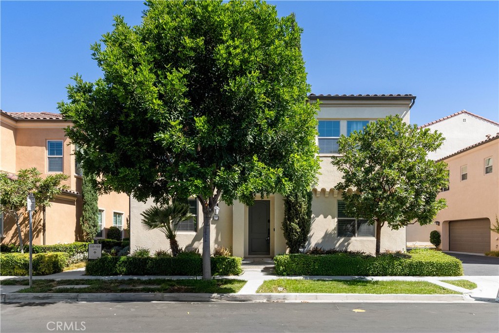 This stylish four-bedroom, three-and-a-half-bathroom home spans approximately 1,835 square feet and showcases refined finishes throughout. Meticulously maintained, the residence opens to a light-filled, airy interior where soaring ceilings and a seamless open-concept layout create an inviting ambiance. The heart of the home is the gourmet kitchen, where sleek quartz countertops, premium stainless steel appliances, and an expansive center island blend form and function—ideal for everyday living and effortless entertaining. The kitchen flows seamlessly into the dining and family rooms, offering a cohesive space to gather with family and friends. A desirable main-level bedroom with a full bath provides versatility for guests, a home office, or multigenerational living. Upstairs, the luxurious primary suite serves as a tranquil retreat, complete with a generous walk-in closet and a spa-inspired bath featuring dual vanities and an oversized walk-in shower. Two additional bedrooms, a well-appointed full bath, and a spacious loft area provide ample room for rest and recreation. Step outside to discover a private backyard sanctuary enhanced by lush landscaping—perfect for alfresco dining or quiet relaxation. Additional features include a two-car garage, newer luxury vinyl plank flooring, and a smart thermostat system. Residents of Portola Springs enjoy access to a wealth of resort-style amenities including Olympic-size pools, playgrounds, sports parks, tennis courts, beach volleyball courts, and elegant clubhouses. With its proximity to award-winning Irvine schools, UC Irvine, premier shopping, and coastal destinations, this move-in ready home presents a rare opportunity to enjoy the very best of Orange County living.