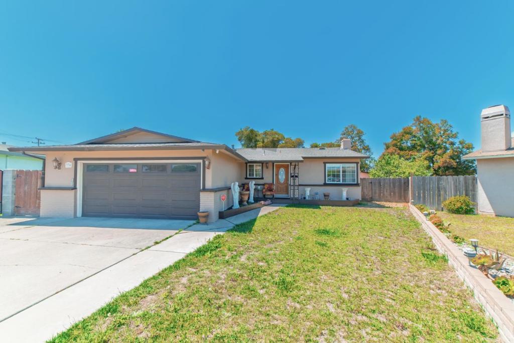 Welcome to this inviting 4-bedroom, 2-bathroom home located in the charming city of Salinas. Situated on a spacious 12,600 square foot lot, this residence offers ample space for outdoor activities and gardening. Inside, you'll find a thoughtfully designed kitchen equipped with marble countertops and a gas oven range, perfect for culinary enthusiasts. The dining area resides conveniently within the kitchen, providing a cozy space for family meals. The home features laminate flooring throughout, adding both style and durability. Enjoy the warmth and ambiance of the fireplace during cooler evenings. For your convenience, the laundry area is located in the garage, simplifying household chores. This property falls within the Salinas City Elementary School District. Additional amenities include central forced air - gas heating and an existing shed for extra storage. With no cooling installed, you'll appreciate the temperate climate Salinas offers. Don't miss the opportunity to make this well-appointed home yours!