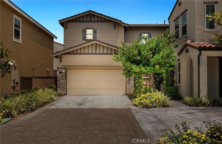 Welcome to the stunning two-story home located in the highly desirable Ontario Ranch community. Built in 2018, this modern residence offers approximately 2,275 square feet of comfortable living space with 4 bedrooms and 3 full bathrooms, including a convenient main-floor bedroom and bath—perfect for guests. The open-concept layout features a bright and spacious great room, a gourmet kitchen with a large center island, granite countertops, stainless steel appliances, and a walk-in pantry. Elegant touches include luxury vinyl flooring, plantation shutters, recessed lighting, and high ceilings. Upstairs you’ll find a luxurious primary suite with dual sinks, a soaking tub, separate shower, and walk-in closet, along with two additional bedrooms and a full Jack-and-Jill bath. Enjoy entertaining in the private backyard with a finished patio and string lights, ideal for gatherings and BBQs. Additional features include a two-car attached garage, tankless water heater, whole-house fan, and energy-efficient construction. Situated within the vibrant New Haven “Avenue” neighborhood, residents enjoy resort-style amenities such as multiple pools, parks, playgrounds, BBQ areas, dog parks, and clubhouse access. Conveniently located near shopping, dining, schools, and major freeways, this move-in ready home perfectly blends modern style, functionality, and community living.