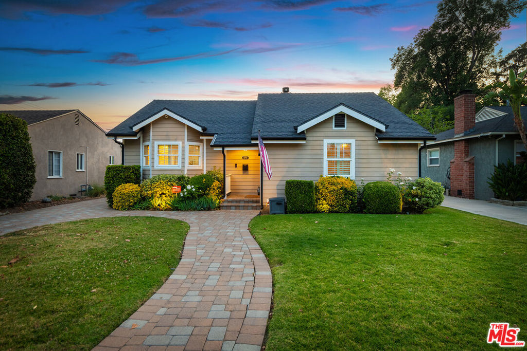 Warm & Welcoming Cottagecore. Completely rebuilt, extended & upgraded 4+2. Bright & airy interior delivers storybook charm without skimping on modern amenities. Charming curb appeal; bay window looking out to lush lawn; Dutch door entrance to foyer. Spacious 2183 sq ft open plan w/sunshine streaming across spacious great room: farmhouse-style kitchen, island w/prep sink, granite tops, farm sink, desk; cozy fireside dining, floor-to-ceiling bookcases; living space & French doors lead to patio. Features incl. shutters, gleaming hardwood floors, ceiling fans, crown molding & wainscoting. Two primary bedrooms: dream walk-in closet, window seats, French doors to outdoors; beautiful big bath has large shower, separate tub, subway tile & dbl vanity; 2nd bath blends modern amenities w/vintage flair. Need more room? Check out the bonus spaces: attic + finished flex room behind detached garage for office or possible ADU. 6745 sq ft lot in prized Valley Glen neighborhood; Sherman Oaks adjacent!