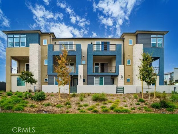 This beautifully upgraded three-story home offers modern living with 3 bedrooms and 3.5 bathrooms. It features soaring ceilings and a spacious balcony that provides scenic views. The first-floor bedroom with an en-suite bath is perfect for guests or a private home office. On 2nd floor, The kitchen is a highlight of the home, with upgraded granite island countertops. Stainless steel appliances, including a refrigerator, microwave, oven, washer, dryer. Master bedroom and third bedroom suite are on 3rd floor with beautiful views. The home is close to park, school, and Portola High School, allowing children to walk to school from kindergarten through high school without the need for relocation. Plus, it's just minutes from Woodbury Town Center, Great Park Ice & Sports Complex, and various recreational facilities in Great Park.This is modern luxury living at its finest - a perfect blend of comfort, style and investment potential you would love. Huge price drop!!! Grreat home with one of best price in the areas.