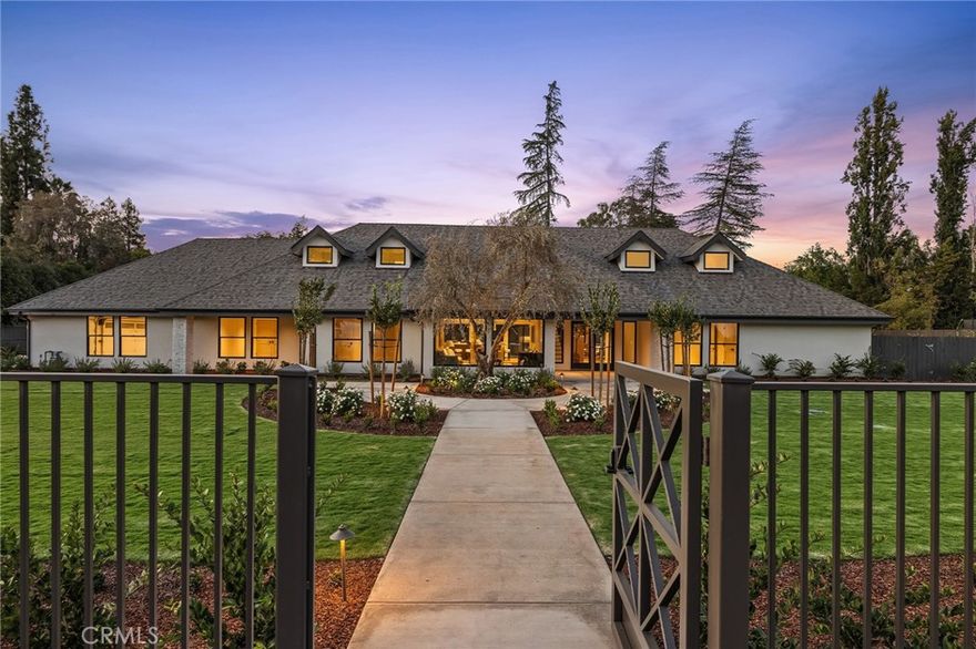 Behind elegant gates in the prestigious Van Ness corridor lies an extraordinary estate that redefines sophisticated living on a perfectly sized .88-acre lot that's oversized yet not overwhelming. This meticulously crafted residence delivers discerning buyers who value their time the ultimate in turn-key luxury living, eliminating the stress of remodeling or building a custom home.



No detail has been overlooked in this architectural symphony, featuring six exquisite bedrooms including a convenient main-floor guest suite that ensures comfort for visitors and multi-generational living alike. Striking black fiberglass Andersen windows punctuate the refined acrylic stucco exterior enhanced with distinctive brick and stone accents, while wide-plank French oak floors flow throughout sophisticated living spaces bathed in amazing natural light throughout all seasons.



The living room features a stunning Heat-N-Glo 72-inch linear fireplace as its centerpiece. The gourmet kitchen stands as a culinary masterpiece with Jenn-Air professional appliances including column refrigerator and freezer, drawer microwave, dual dishwashers, and impressive 48-inch range with griddle functionality. Quartzite and soapstone countertops provide both beauty and durability.



Climate control reaches new efficiency heights with state-of-the-art Lennox variable speed, whisper-quiet heat pump system, complemented by dual Navien tankless water heaters featuring recirculating pumps. The home features R-49 attic insulation plus insulated roof deck, creating exceptional comfort while significantly reducing cost of living through superior energy efficiency. Three strategically placed laundry facilities, including upstairs Bosch heat pump washer and dryer positioned within the primary suite's luggage room, elevate convenience.



The isolated primary bedroom with private loft creates an impressive nearly 1,300 square foot sanctuary. The primary bathroom features dual commodes with Kohler tankless bidet toilets. Step outside to discover a pristine Pebble pool with protective cover, surrounded by landscape design crafted by renowned landscape architect Bob Truxell.



The generous lot opens remarkable opportunities for personalization, whether envisioning private orchard, concealed ground-mount solar, or potential shop and accessory dwelling unit development. A separate gated entrance provides secure recreational vehicle storage.



This is luxury living redefined.