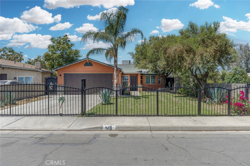 Nestled on a lovely street, this enchanting residence boasts a stunning iron fence at the front, complemented by meticulously maintained landscaping that welcomes the home. Inside, you'll find beautiful tile flooring throughout the entire house, creating a seamless and elegant look. The kitchen features gorgeous cabinets, offering ample storage and style. The spacious bedrooms provide comfort and versatility for family or guests. Step outside to a huge backyard perfect for outdoor entertaining, complete with a charming patio ideal for gatherings or relaxation. This property combines curb appeal with thoughtful interior design and outdoor space a perfect place to call home.