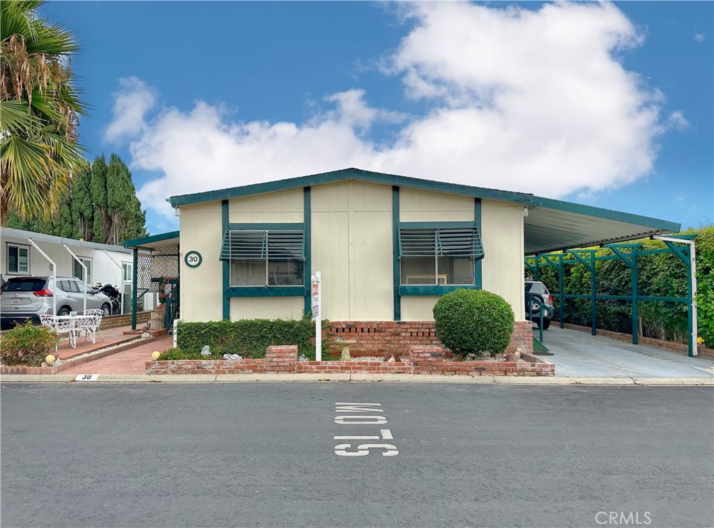 Welcome home to Santiago Estates, located in the heart of the city of Orange! This immaculate community radiates pride of ownership from its residents with its well manicured grounds, well kept amenities (pool, clubhouse, and more!), and gorgeous homes! The home itself features: Almost 1500 sf of living space; 2 large bedrooms and 2 full bathrooms; Open floor plan with the spacious kitchen flowing into the expansive living room (bonus feature is fireplace!); Formal dining room with built-in cabinetry; In-door laundry room; Spacious covered patio with secondary patio in the backyard; Covered carport with room for multiple cars; Bonus...The roof, HVAC systems, kitchen appliances, and water heater have all been upgraded! **Space rent is $1510 and includes water!**
