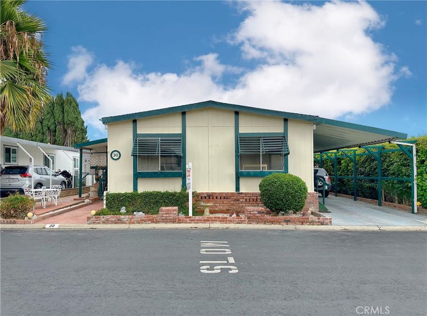 Welcome home to Santiago Estates, located in the heart of the city of Orange! This immaculate community radiates pride of ownership from its residents with its well manicured grounds, well kept amenities (pool, clubhouse, and more!), and gorgeous homes! The home itself features: Almost 1500 sf of living space; 2 large bedrooms and 2 full bathrooms; Open floor plan with the spacious kitchen flowing into the expansive living room (bonus feature is fireplace!); Formal dining room with built-in cabinetry; In-door laundry room; Spacious covered patio with secondary patio in the backyard; Covered carport with room for multiple cars; Bonus...The roof, HVAC systems, kitchen appliances, and water heater have all been upgraded! **Space rent is $1510 and includes water!**