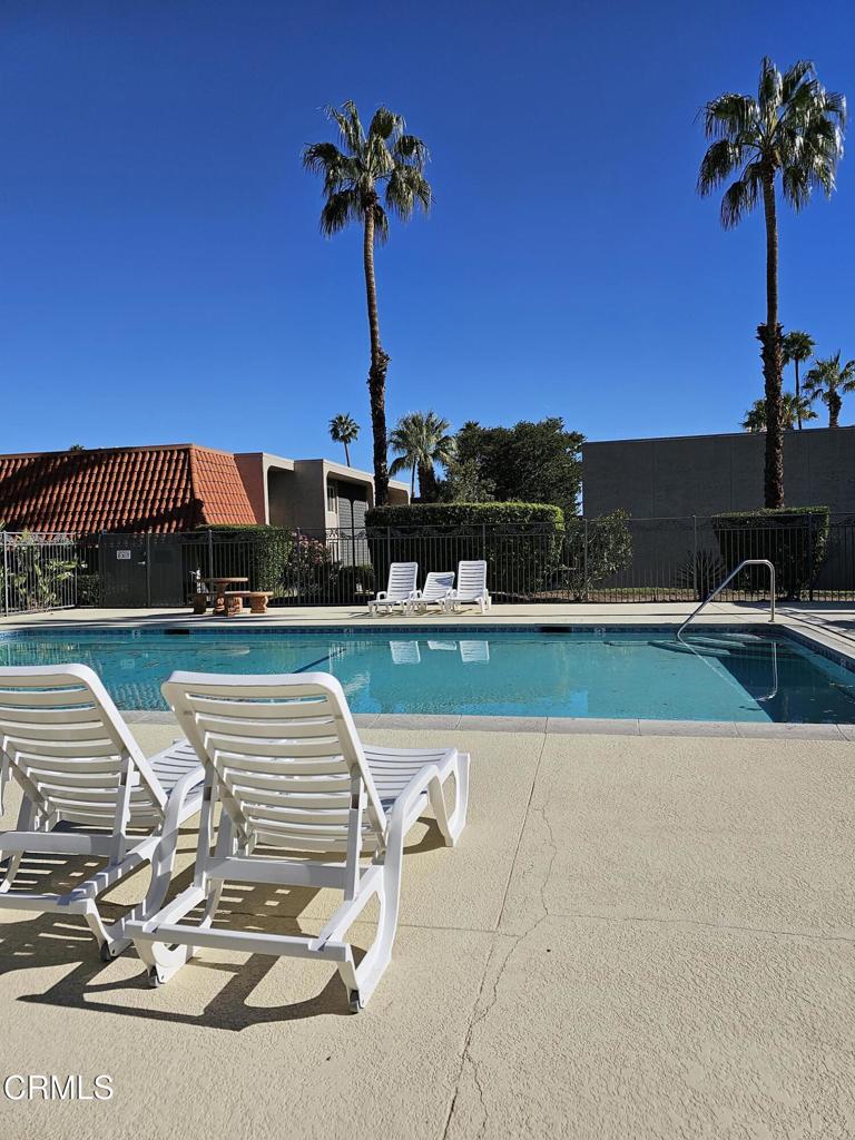 Palm Springs gated community. This 1,344 square foot, 3 bedroom, 1 and a half bath unit with walk in closets is in a prime location. Condo features newer paint, newer stainless steel appliances, newer carpet, newer light fixtures and beautiful new blinds, and is in pristine condition. Condo has a newer washer and dryer in unit. Beautiful private patio with mountain views for barbequing and entertaining, two covered parking spaces and storage closets directly behind the unit. Pool and spa are conveniently located. Located near Downtown Palm Springs shopping, restaurants and galleries.