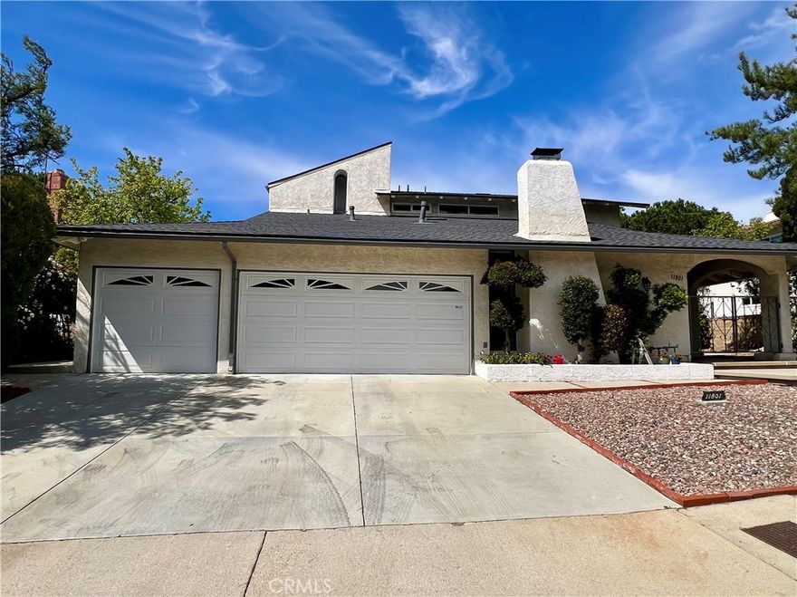 Welcome to 11801 Thunderbird Ave, a beautifully updated two-story single-family home located in the highly sought-after Porter Ranch community. Set on an expansive 13,959 sq ft lot, this 2,412 sq ft residence blends modern luxury, energy efficiency, and breathtaking city views.



Inside, you will find a light-filled, open-concept living space with high ceilings, custom cabinetry, and luxurious finishes throughout. The chef’s kitchen features new stainless steel appliances, granite countertops, and plenty of space for entertaining.



Enjoy seamless indoor-outdoor living with a sparkling, oversized in-ground pool, newly landscaped grounds, and an additional driveway for extra parking. This home is perfect for both intimate gatherings and large celebrations.



Equipped with a state-of-the-art smart home system, you can easily control lighting, security, and climate from anywhere. Energy-efficient features ensure comfort and cost savings year-round.



Additional highlights include a three-car garage, a spacious layout with elegant design touches, and spectacular city views. The prime location is just minutes from top-rated schools, shopping centers, and entertainment.



Don’t miss this rare opportunity to own a fully upgraded home in one of Porter Ranch’s most prestigious neighborhoods. Come experience the perfect balance of modern living and natural beauty.
