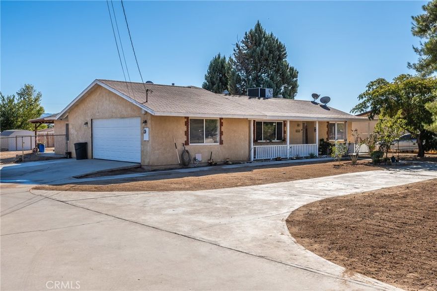 Nestled in a quiet neighborhood, this 1,513 Sq. Ft. single-story home sits on a generous 0.42 acre lot, offering privacy and functionality. Enjoy modern touches with recessed lighting throughout, durable vinyl and tile flooring, and an updates kitchen showcasing quartz countertops, a large island and ample cabinetry. Spacious 3 bedrooms and 2 bathrooms, designed with comfort in mind. The property features a long driveway with RV parking, a large fenced backyard, and a covered patio perfect for outdoor entertaining. Conveniently located near Maple Elementary, Hesperia Junior High, and Hesperia High School, along with shopping, parks and easy commuter access. This home is move-in ready and waiting for you! Don't miss out - schedule a tour today!