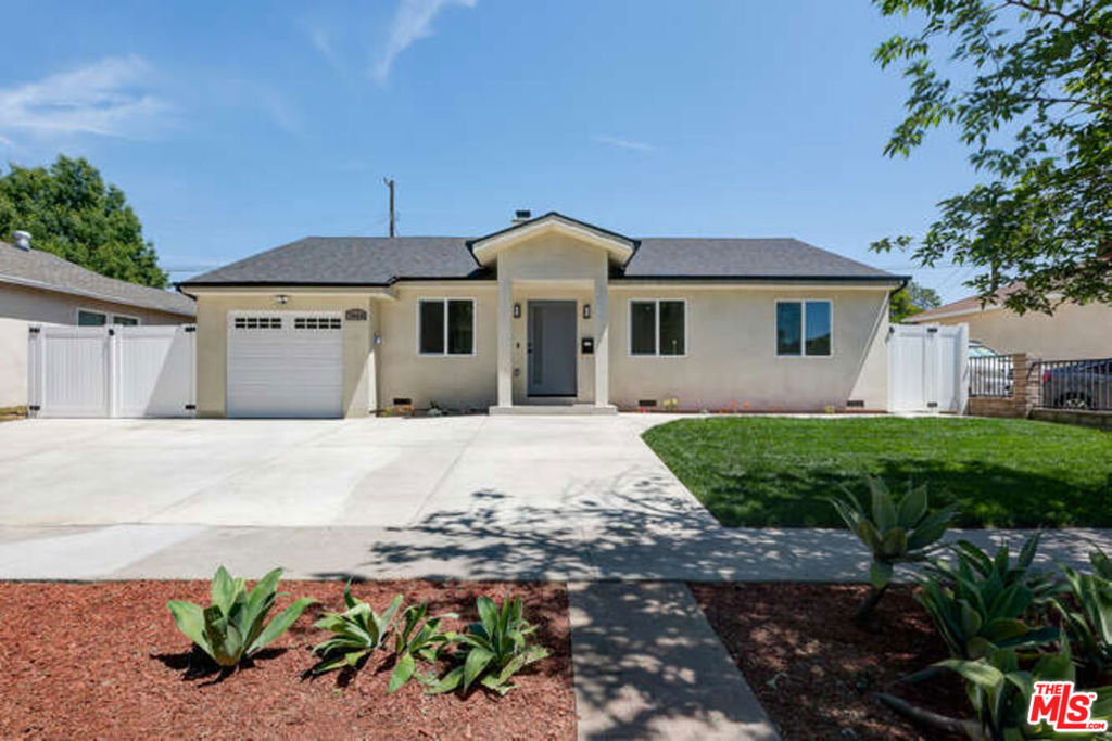 Completely Remodeled Beauty in Prime Lake Balboa! Welcome to your dream rental home! This stunningly remodeled 4-bedroom, 3-bathroom residence is located on a beautiful street in the highly desirable Lake Balboa neighborhood. From top to bottom, no detail has been overlooked this home offers the perfect blend of modern elegance and everyday comfort. Step inside to a bright and open floor plan featuring recessed lighting, laminated flooring, and a cozy fireplace with a custom mantle creating the perfect gathering spot in the spacious living room. The kitchen is a true highlight, boasting stainless steel appliances, stylish cabinetry, and quartz counter tops. All bathrooms have been tastefully updated with modern fixtures. Enjoy a beautifully landscaped front yard and a backyard ideal for relaxing or entertaining family and friends. Located close to parks, shopping, and dining, this turnkey home offers comfort, style, and convenience in one of the Valley's most sought-after neighborhoods.