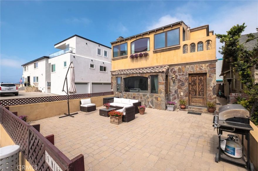 Experience the ultimate beach lifestyle in this charming Mediterranean-style house, perfectly positioned just 50 yards from the pristine Hermosa Beach shoreline. This thoughtfully designed 3-bedroom, 3-bathroom home offers 1,650 square feet of coastal living at its finest.



Step inside to discover engineered wood floors flowing throughout the first level, creating warmth and elegance. The inviting breakfast nook provides the perfect spot for morning coffee, while the wood-burning fireplace adds cozy ambiance for evening gatherings. The primary bedroom features stunning ocean views, making every morning feel like a vacation. Air conditioning ensures year-round comfort.



The outdoor space truly shines with a private yard ideal for entertaining and a unique outdoor shower for rinsing off after beach days. Located on a peaceful walk street, this home offers tranquil residential living while remaining incredibly close to the action.



Hermosa Beach's vibrant neighborhood surrounds you with world-class dining and nightlife options just a short stroll away. The iconic Hermosa Pier and The Strand are practically at your doorstep, offering endless opportunities for surfing, beach volleyball and cycling 



The convenience continues with a 2-car garage providing secure parking – a rare find in this beachside location. Whether you're hosting sunset gatherings in the yard, enjoying ocean breezes from the primary bedroom, or taking spontaneous beach walks, this Mediterranean gem delivers the quintessential California coastal experience. This is beach living at its most authentic and accessible.