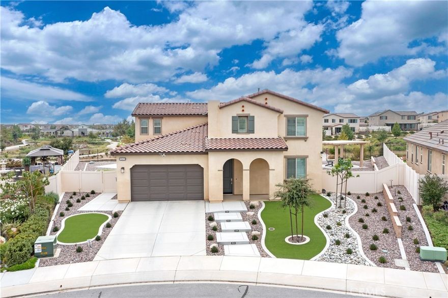 Step into modern comfort and style at this beautifully upgraded two-story home in Banning. With 2,286 sq ft, 4 bedrooms, and 3 full baths, this home was designed for both everyday living and effortless entertaining. From the moment you walk in, the open floor plan with sleek LVP flooring and plantation shutters sets the tone for a bright and welcoming space. The chef’s kitchen comes complete with stainless appliances, while the great room and dining area flow seamlessly together, creating the perfect backdrop for family gatherings and celebrations. Retreat upstairs to the spacious primary suite featuring a soaking tub, separate shower, and plenty of room to unwind. Smart home features, energy-saving upgrades, and a 2-car garage with EV charger bring modern convenience at every turn. Outside, your private backyard oasis awaits with professional landscaping, extended patio cover, and freestanding lattice with ceiling fans—ideal for summer barbecues, quiet evenings under the stars, or hosting friends year-round. Bonus Paid off Solar! This is more than just a home—it’s a place where memories are made.
