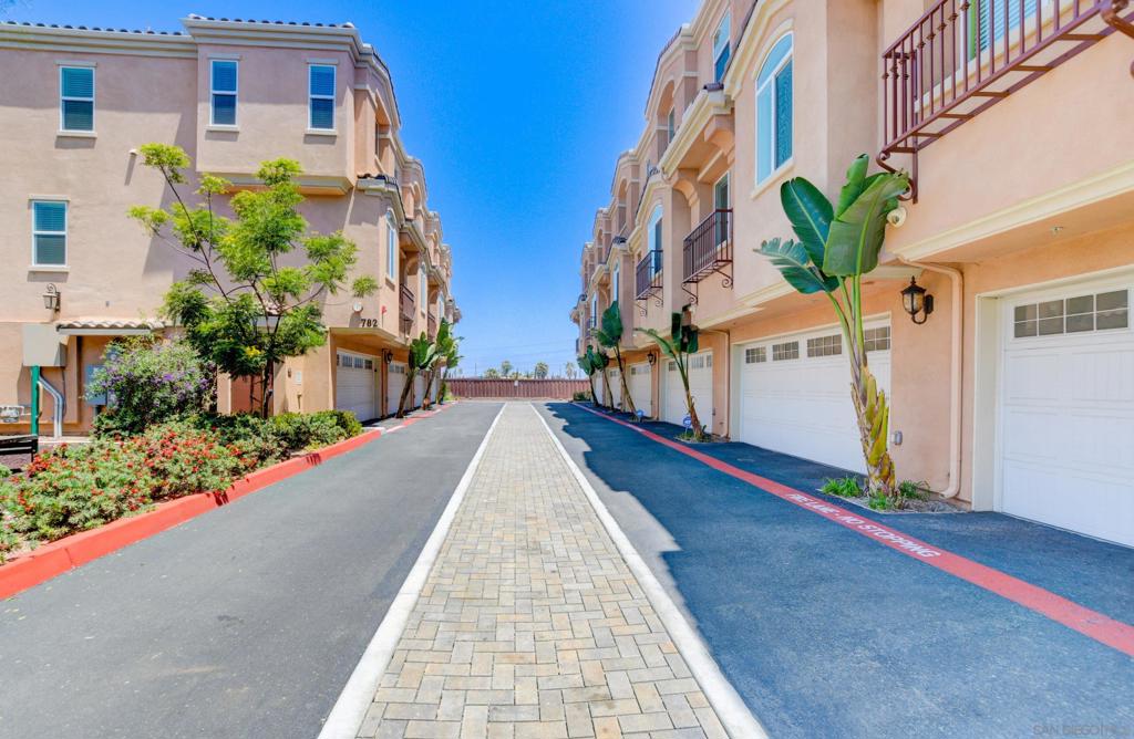 This upgraded tri-level townhome in the gated Bahia Vista community of Southwest Chula Vista offers 3 bedrooms, 3 full bathrooms, and 1,636 sq. ft. of beautifully designed living space. Built in 2016, the home features high ceilings, large windows that flood the space with natural light, and ocean views from select rooms. The entry level includes a two-car garage, ( + 1 guest parking permit), one bedroom, and a full bathroom perfect for guests or roommates. The second level is where you’ll find the front entry, an open-concept living and dining area, a modern kitchen, and a balcony off the living room that’s great for relaxing or entertaining. The third level features a spacious primary suite with a dual-sink vanity, walk-in closet, and a private balcony facing east, along with another bedroom that includes an en suite bathroom and west-facing ocean views. Additional highlights include central AC and heat, in-unit side-by-side laundry hookups, and a gated community with small shared common areas. Located just minutes from I-5, the trolley, Downtown Chula Vista, shopping, dining, parks, and top-rated schools in the Sweetwater Union District, this home combines style, comfort, and convenience in one of Chula Vista’s most central and sought-after neighborhoods.