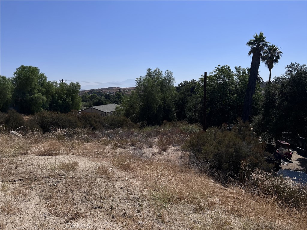 Land for sale in a great location in Wildomar. Situated at the top and just off of Bundy Canyon, just before it connects to Scott Road and becomes Menifee, this 40x100ft parcel of land offers tons of opportunity for development, or to buy and hold as an investment. Utilities are at the street, allowing for easy connection to city water/electricity. The city is in talks to repave Bundy Canyon Rd with 2 lanes in each direction equipped with street lights, further adding to the potential future value of this parcel of land. It's location provides convenient and easy access to the 15 & 215 freeways, shops, dining, and more! City of Wildomar allows for manufactured homes, but buyer to due their own due diligence.