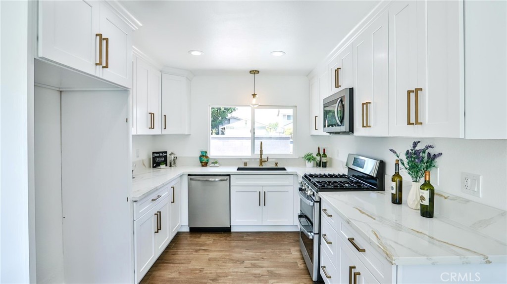 WOW! Don't miss out on this highly upgraded, carefully designed pool home! Minutes to retail stores and freeways and parks...Nestled in the heart of Lake Forest is this beautiful single-story home with gorgeous curb appeal & Private courtyard! As you enter, you will immediately notice all the details that makes this home stand out above the rest. The open floor plan is truly an entertainer’s delight showcasing custom paint, wood like tile flooring, elegant cozy fireplace, large baseboards, double pane windows and recessed lightings! The highly upgraded, eat in kitchen is a Chef's dream! It features the very sleek & durable quartz counter tops, white shaker soft closing cabinetry, modern black stainless steel sink! The new state of the art appliances includes a microwave, gas stove with griddle and double oven, custom hood and stainless-steel dishwasher! Cozy up to the fireplace in the family room on those cool, Cali nights! The Master bedroom features mirrored closet doors .Both elegant bathrooms have been upgraded with new vanities, new toilets, exquisite tile designs with elegant fixtures. New central AC/ HVAC ....The entertainer's backyard is perfect to hang out with friends, take a dip in the large pool, relax in the spa! What are you waiting for? Put in your offer now!