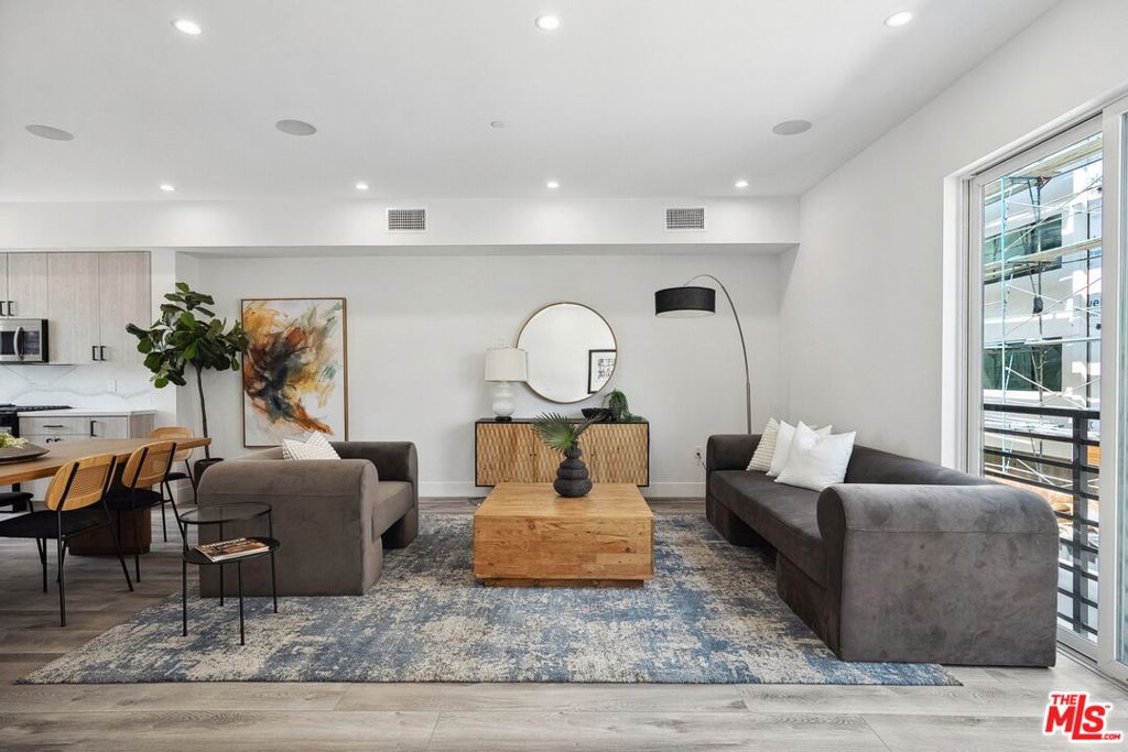 Step into contemporary luxury with this stunning new construction townhouse, nestled in the sought-after Crestview neighborhood. Spanning 2,097 sqft, this 3 bed, 4 bath home features an open-concept layout with tall ceilings and an abundance of natural light, complemented by high-end finishes throughout. The chef's kitchen is a true highlight, offering sleek marble countertops, premium stainless steel appliances, and a large island perfect for entertaining. Enjoy spacious bedrooms with walk-in closets and ensuite baths, including a luxurious separate level primary suite with private balcony. The rooftop deck provides a serene space to relax or entertain while taking in views of the city. Located just moments from Beverlywood, Beverly Hills, and Culver City, this townhouse blends modern design, convenience, and sophisticated living in one of LA's most desirable neighborhoods.