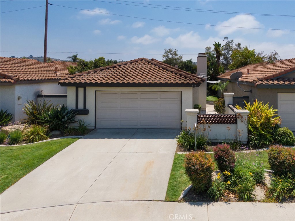 Welcome to a beautifully upgraded single-level home that combines the best of modern living with an incredible coastal lifestyle. Nestled on a peaceful cul-de-sac, this 3-bedroom, 2-bath residence offers a perfect blend of style, comfort, and convenience, all just five miles from the beach. Step inside to a bright and open floor plan, where stunning tile flooring flows seamlessly throughout the main living areas, creating a clean and elegant feel. The heart of the home is the updated kitchen with sleek granite countertops, an abundance of cabinetry, and modern appliances that make cooking a joy. Each of the three bedrooms is a private retreat, featuring a ceiling fan for year-round comfort and ample closet space. The two full bathrooms have been tastefully updated with contemporary fixtures and finishes. Outside, the private backyard is a peaceful sanctuary for relaxation or gatherings. Enjoy the bounty of your very own fruit tree and create lasting memories in this outdoor haven.