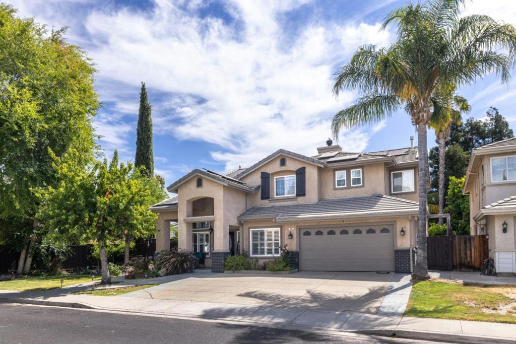 This beautifully maintained 4-bedroom, 3-bathroom home is located on a quiet cul-de-sac in Brentwood, offering 2,590 sq ft of spacious living. Highlights include an updated kitchen with modern appliances, an open family room with a gas fireplace, and a private backyard with a solar-heated pool and fruit trees. Energy-efficient features include owned solar panels and an EV-ready garage. The home features a downstairs bedroom and full bath, multi-zone HVAC, and a luxurious upstairs primary suite with a walk-in closet, fireplace, and scenic views. Stylish flooring and thoughtful upgrades make this home move-in ready.