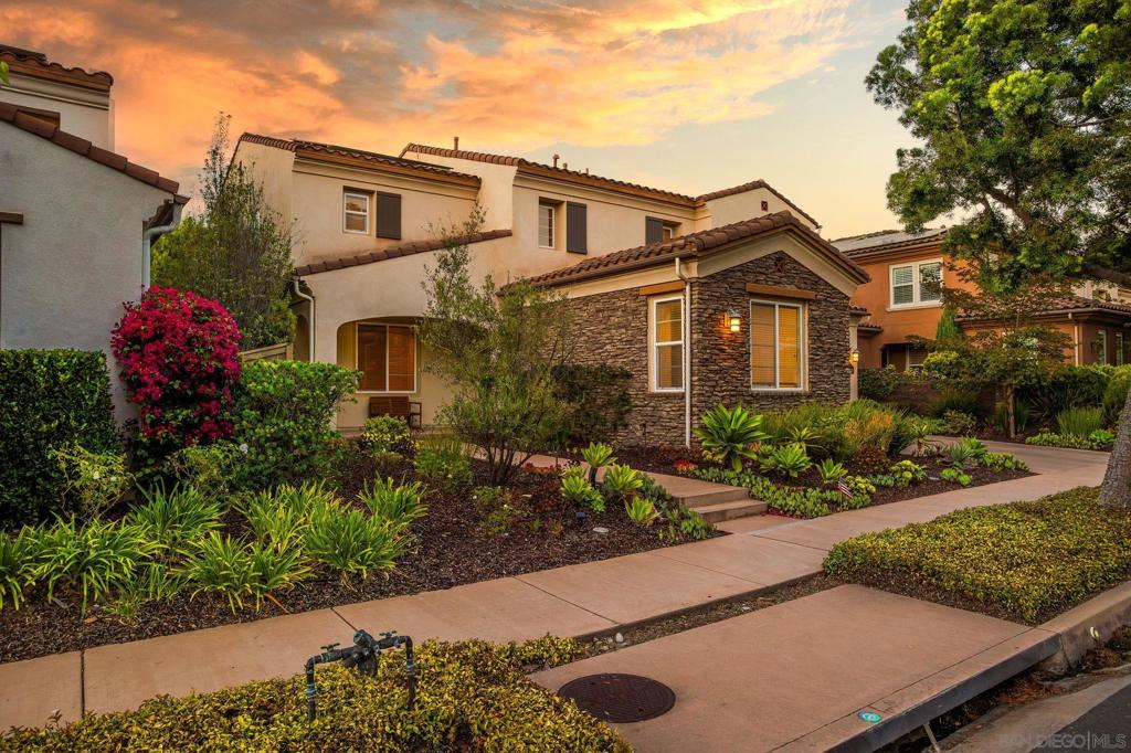 Step into a home where style meets comfort, with every detail designed for modern living. This Mediterranean-inspired farmhouse welcomes you with an expansive 3-car tandem garage, an airy open-concept living room, and a chef’s kitchen featuring brand-new quartz countertops and stainless steel appliances. Updated flooring runs throughout the home, with luxury vinyl plank on the first floor and plush carpeting upstairs for both durability and comfort. The convenience of owned solar keeps energy costs low and eco-friendly. Just off the kitchen, you’ll discover the signature Del Sur Room—a covered outdoor patio that blends seamlessly with the interior for year-round indoor–outdoor living. Whether you’re grilling, entertaining, or relaxing by the fireplace, this space makes every season feel like San Diego perfection. The first floor also includes a highly sought-after bedroom and full bath, perfect for guests or multi-generational living. Upstairs, the luxurious primary suite feels like a spa retreat with its oversized soaking tub, dual vanities, and spacious layout. Outdoors, the private backyard sits on a larger lot, creating a true retreat. Complete with a fireplace, mounted TV, elegant hardscape, lush turf, and garden-ready space for herbs or veggies, it’s both an entertainer’s paradise and a family haven all in one. Location is everything, and this home delivers. It’s within walking distance to Del Sur Elementary and just minutes from Del Sur Town Center and 4S Commons for shopping, dining, and weekend fun. Beyond your front door, the perks continue with access to top-rated schools and an amenity-rich community featuring 11 pools & 14 Parks as well as biking and hiking trails, a clubhouse, and a recreation center. This home isn’t just a place to live—it’s a lifestyle.