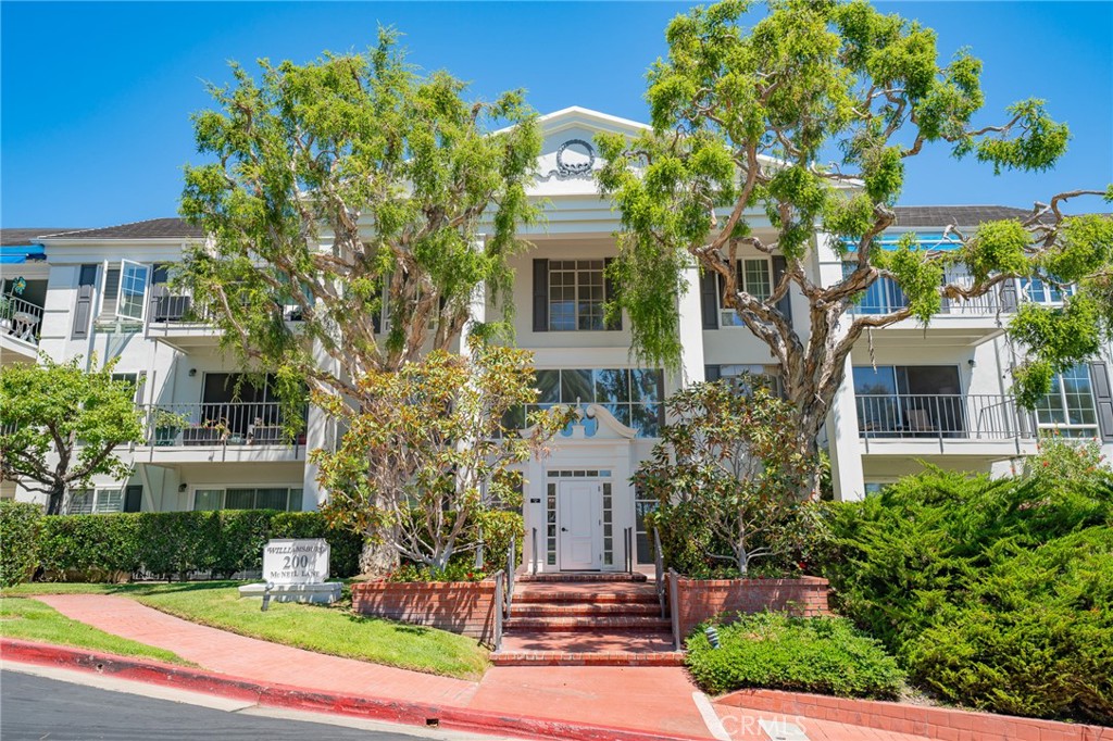 UPDATED 2 BED 2 BATHS UNIT IN THE GATED COMMUNITY OF VERSAILLES CITY OF NEWPORT BEACH! Step inside and will notice how open the property feels with the living, dining, and kitchen all connected. Wood flooring throughout. The living room includes a fireplace perfect to cozy up to on those cold evenings, with a nicely tiled and wood wall design. Recessed lighting. The patio door allows plenty of natural light inside. The kitchen is upgraded with stainless steel appliances, a built-in microwave, plenty of countertop space, and cabinets with plenty of storage space. Total 2 bedrooms, each with a ceiling fan and tall windows to allow natural light in with plantation shutters. The bathrooms are upgraded with modern finishes. Direct access to your own outdoor patio space. Just a short distance to the beach, Fashion Island, Lido Marina Village, Balboa Peninsula, and much more.