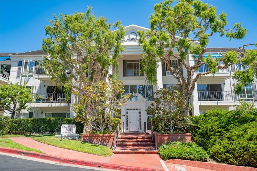 UPDATED 2 BED 2 BATHS UNIT IN THE GATED COMMUNITY OF VERSAILLES CITY OF NEWPORT BEACH!  Step inside and will notice how open the property feels with the living, dining, and kitchen all connected.  Wood flooring throughout.  The living room includes a fireplace perfect to cozy up to on those cold evenings, with a nicely tiled and wood wall design.  Recessed lighting.  The patio door allows plenty of natural light inside.  The kitchen is upgraded with stainless steel appliances, a built-in microwave, plenty of countertop space, and cabinets with plenty of storage space.  Total 2 bedrooms, each with a ceiling fan and tall windows to allow natural light in with plantation shutters.  The bathrooms are upgraded with modern finishes.  Direct access to your own outdoor patio space.  Just a short distance to the beach, Fashion Island, Lido Marina Village, Balboa Peninsula, and much more.