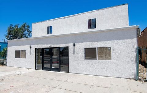 Photo of 1659 W Florence Avenue, Los Angeles, CA 90047 (MLS # SR26162864)