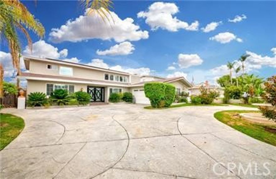 Welcome to this beautifully remodeled 4 bedrooms and 2.75 bathrooms home nestled in the prestigious "Bellehurst" neighborhood of Buena Park. This updated property features a bright and open layout with laminate & tile flooring throughout. The gourmet kitchen with quartz countertops, white cabinetry and stainless steel appliances, ideal for both entertaining and everyday living. The spacious master bedroom includes a private en suite bathroom with stylish upgrades. The inviting family room opens directly to a resort-style backyard, complete with a Pebble Tec pool and spa, perfect for relaxing or entertaining. Located in a quiet, well-established neighborhood just minutes from Los Coyotes Country Club & Golf Course. Award winning Sunny Hills high school district. Close to metro link station, shopping centers, restaurants, markets, schools and parks.
