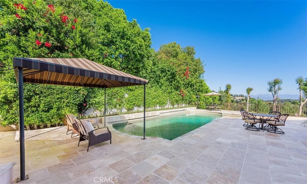 Located in the highly sought after Bel Air Park community, this gorgeous remodeled family home is on a quiet cul-de-sac. This 4 bedroom, 4 1/2 bathroom home sits on a 1.4 acre lot with jetliner views. The house offers an impressive 4,837sqft of living space, filled with abundant natural sunlight that flows through every room. The open floor plan includes exquisite high ceilings creating a welcoming atmosphere, perfect for entertainment. The home is move in ready and impeccable, as it has been meticulously maintained and kept in pristine condition with utmost care. Outside, you discover a huge yard with panoramic views, a fruit garden, saltwater pool and a relaxing spa to unwind. This home is an entertainer's dream, offering a seamless indoor-outdoor flow with breathtaking views and ample space. Solar on property is fully paid off.