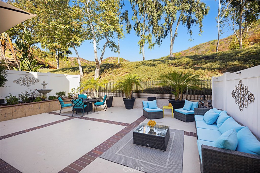 Better than new, this beautifully upgraded home offers an ideal floor plan, spacious backyard, and hillside views. Welcome to 75 Mira Mesa, nestled in the desirable Sausalito community in the heart of Melinda Heights. This two-story residence features 3 bedrooms plus a loft, 2.5 baths, and a 2-car attached garage with driveway parking. Inside, the open living and dining areas are enhanced by Italian porcelain tile floors, designer paint, modern lighting, and a cozy fireplace—perfect for both everyday living and entertaining. Upstairs, the primary suite boasts dual closets, a walk-in shower, and a relaxing oval soaking tub. The secondary bedrooms are generously sized and complemented by a versatile loft space. Step outside to the expansive backyard with manicured landscaping and hardscape, backing to a picturesque hillside where you can enjoy tranquil views and even spot deer and other wildlife.
All of this in a sought-after neighborhood with access to top-rated schools, parks, and the best of Rancho Santa Margarita living.