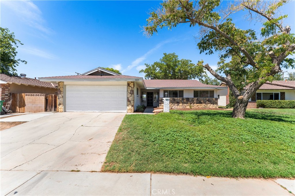 Welcome Home! This COMPLETELY REMODELED single story offers 3 bedrooms, 2 full baths and 1,392 square feet of living space! Functional floor plan with two large living spaces that share a beautiful dual sided brick fireplace! GORGEOUS kitchen with NEW cabinets, stainless steel appliances, quartz countertops and tile backsplash. New flooring and baseboards throughout PLUS fresh interior and exterior paint. Modern bathrooms with new plumbing and electrical fixtures. Large backyard with FRESH sod and a mature shade tree. This is truly a MUST SEE HOME!