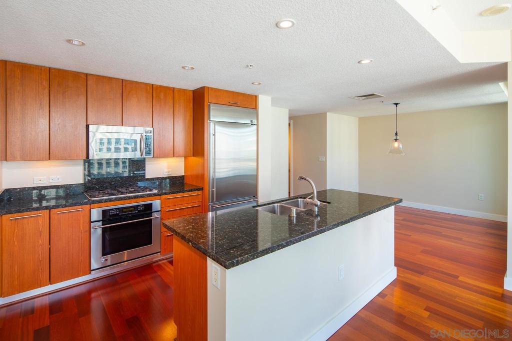 Elevate your living experience w/ this spacious 1 bedroom, 1 1/2 bath residence in an unrivaled location, steps to Little Italy. Enjoy breathtaking city & harbor views w/ lux interior finishes, featuring granite countertops, premium appliances & Brazilian cherry wood floors. The Grande is one of the finest high-rise residential towers on the West Coast, offering lap pool, spa, fitness, sauna & steam rooms, community lounge, business center, guest suite, concierge, guest parking, & 24-hr security. WILL ACCEPT PETS The Grande includes arguably the best Property Management & Concierge Service of any of the full amenity high-rise towers Downtown. Find such services as 'drop-off & pick up' dry cleaning at your doorstep. If you receive packages, no need to worry, as concierge will keep your packages in the secure package room until you return. Security is premier at The Grande. Enjoy the comfort of knowing the 24 hour security team is ever vigilant & close by if needed. Life at The Grande is whatever you would like it to be. From the spectacular entrance lobby to world-class full service The Grande delivers. Luxurious amenities include: 4 elevators, concierge service, security, closed-circuit cameras provide 24-hour surveillance, 80-foot outdoor swimming pool, spa, barbeque area, fitness facility w/ lockers, sauna & steam room, party lounge w/ pool table & flat screen TV's, 1 secure underground parking space, individual storage room, on-site professional management & luxurious 1 bedroom guest suite available for short term use by Grande North residents & their guests.