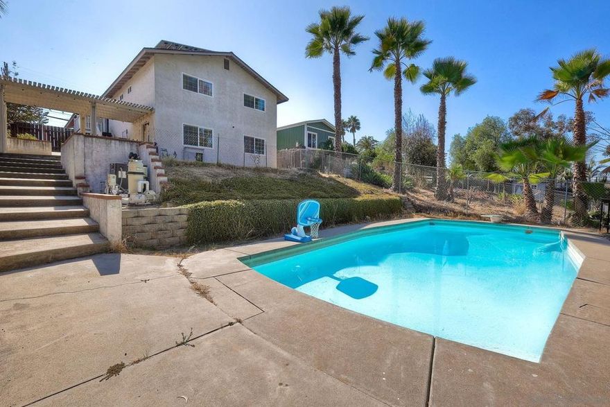 Great 3 bedroom 2 bath home with a downstairs oversized bonus room, not included in square footage, with direct access to the private pool.  The bonus room is currently set up with 2 queen beds but this would also make an amazing family room, approximately 300 to 350 square feet with a private entry to the backyard.  Newer gas heater for the pool and spa. New water heater, water filtration system and paid solar panels! Gorgeous wood floors and updated Main bathroom and guest bathroom.  This property is fully fenced with multiple levels of terraces to enjoy the outdoor California living.  Easy access to freeways and close to all.  Property has been functioning as a full time air b and b with great profits.