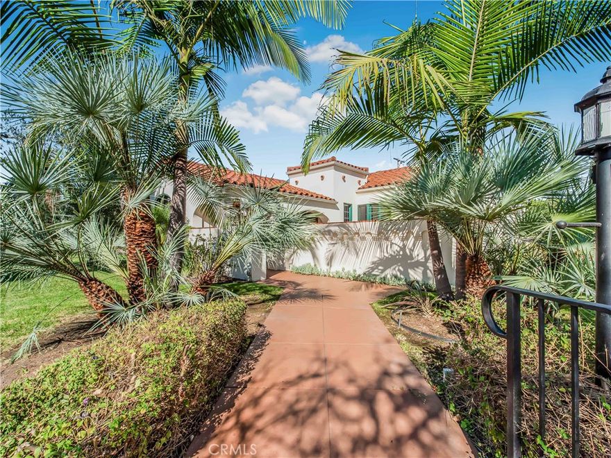 Welcome to this 1935 single-story Classic Spanish home, gracefully situated on a corner lot, on the most desired street in Bixby Knolls, Myrtle Avenue! The main residence offers 4 bedrooms and 3 baths with 1,921 sq ft., complemented by a beautifully finished 347 sq ft. garage conversion with a half bath perfect as a studio, office, or guest retreat. This home blends timeless architectural character with needed modern updates. Highlights include arched leaded-glass windows, coved and tray ceilings, a dramatic living room with a wood-beamed ceiling and fireplace, and a versatile study/office. The primary suite enjoys direct access to the backyard, creating seamless indoor-outdoor connection. A sunlit kitchen with a breakfast nook opens seamlessly for every day living. Enjoy a private front courtyard and a flagstone patio with a fire feature, perfect setting for entertaining. The 7,054 sq ft. lot offers abundant off-street parking and the garage equipped with electrical to support EV charging. Meticulously restored and maintained, this home combines classic Spanish charm with modern conveniences. A true Bixby Knolls treasure! Do Not miss out on this incredible home and living your dream!  It is a MUST See for your self!